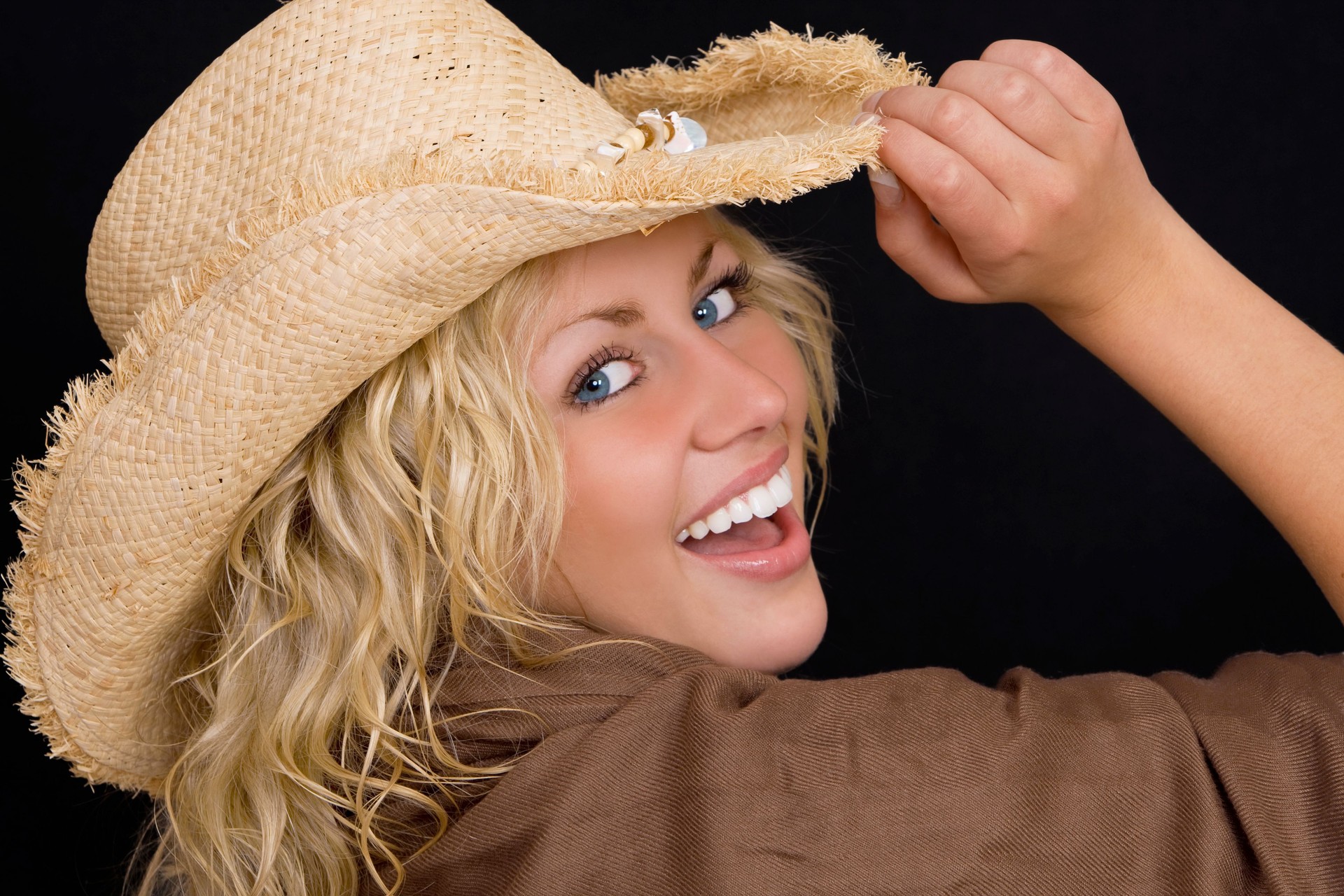 Beautiful Happy Young Blond Woman In A Straw Cowboy Hat