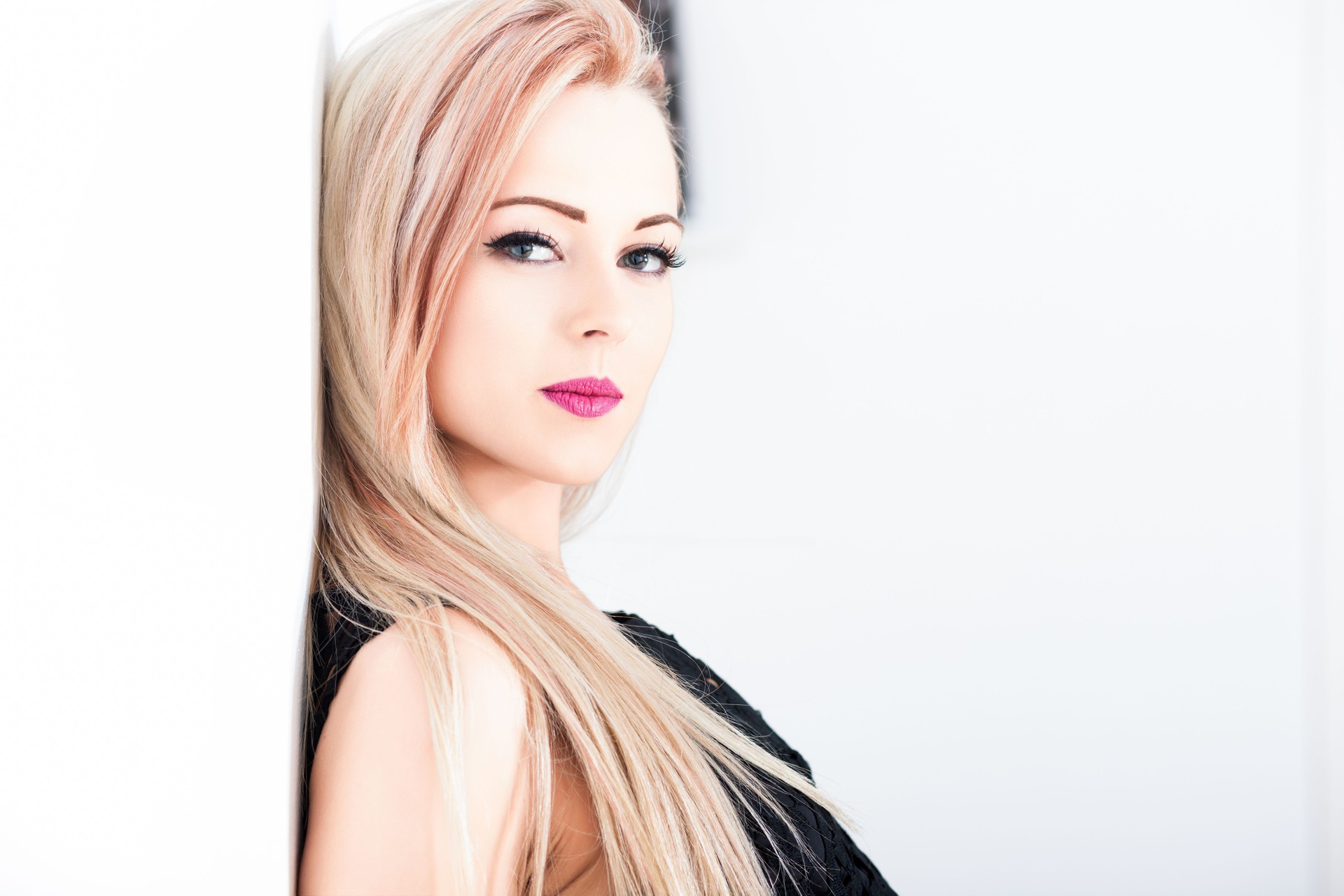 Attractive blonde woman posing with serious expression